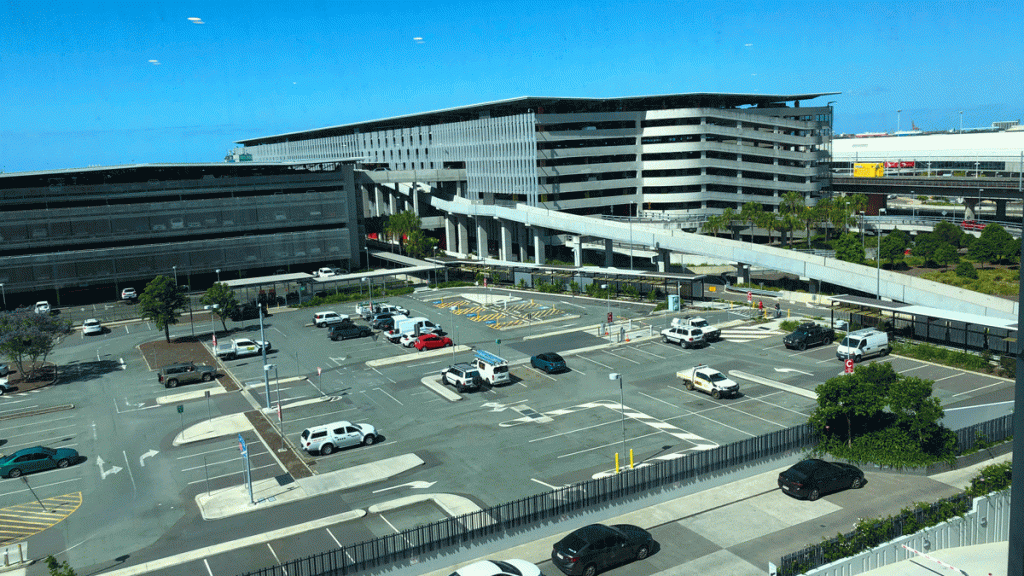 a parking lot with cars and a building