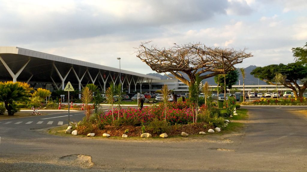 a flower bed in front of a building