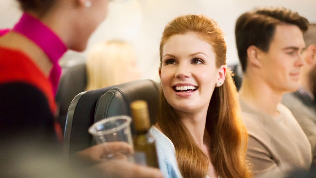 a woman smiling at another woman