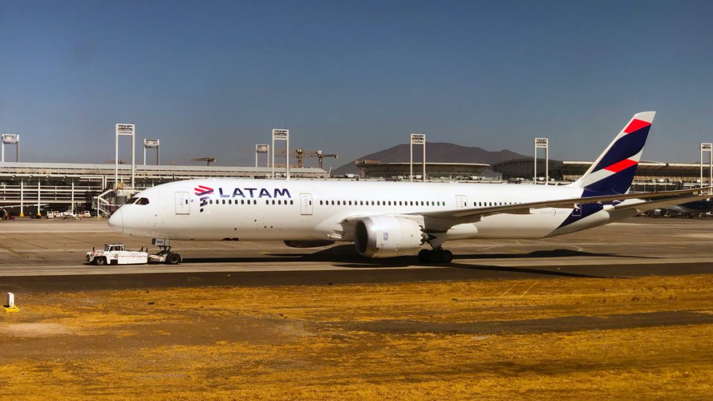 a large white airplane on a runway