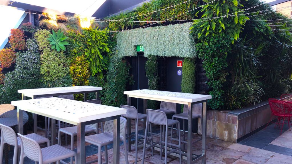 a group of tables and chairs outside