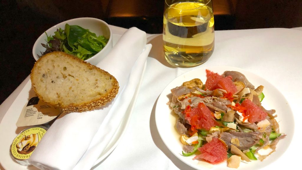 a plate of food and a glass of water