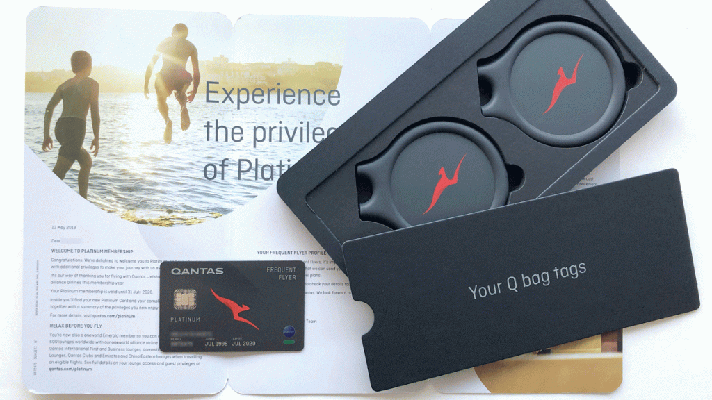 a black box with a red logo on it next to a card