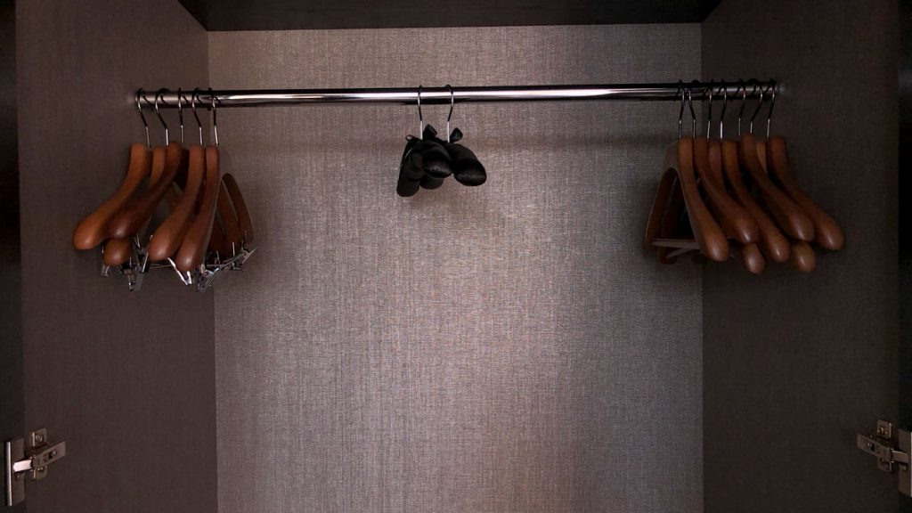 a closet with swingers and shoes