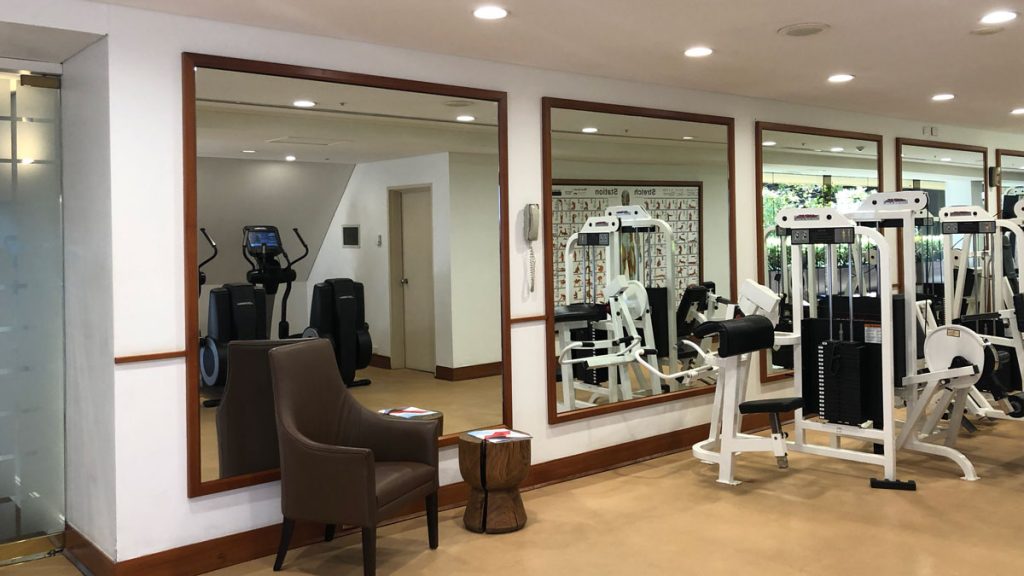 a mirror in a room with exercise equipment