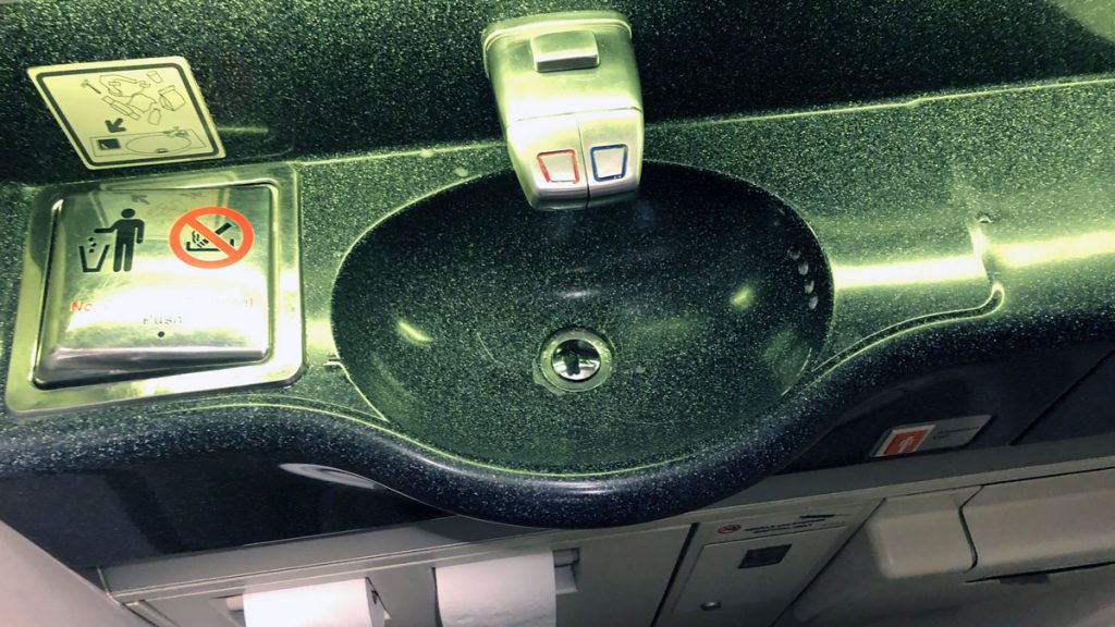 a sink with buttons and switches