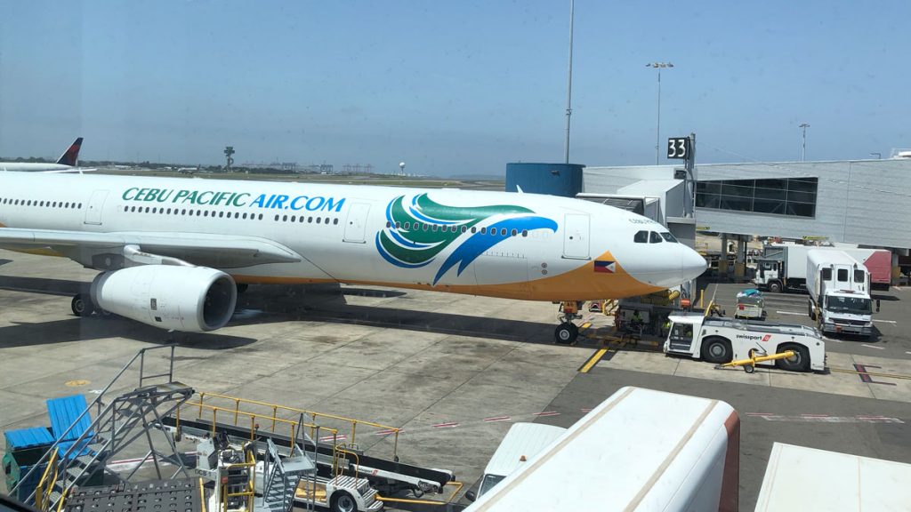 a large white airplane at an airport