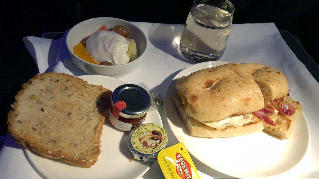 a plate of food and a glass of water