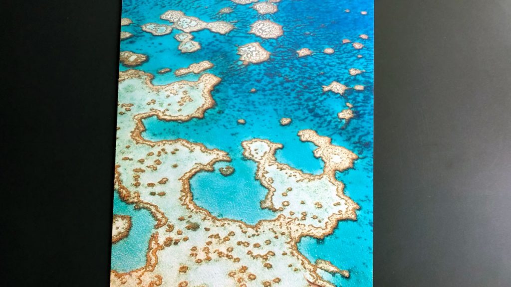 an aerial view of a blue ocean