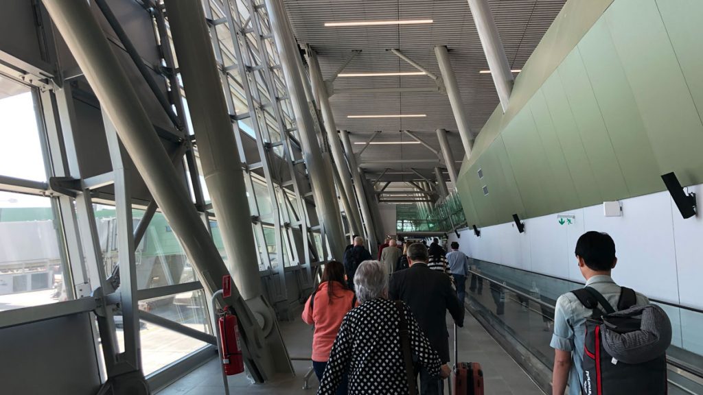 a group of people walking in a building