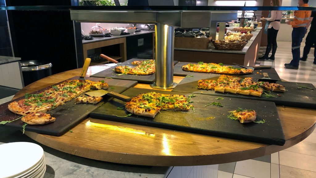 a pizza being prepared on a table