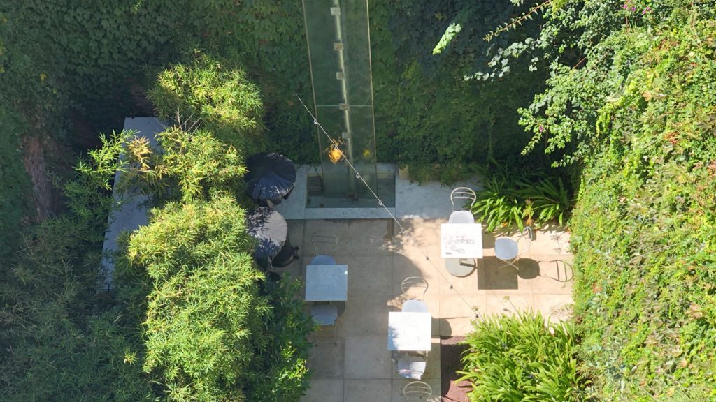 a patio area with tables and chairs