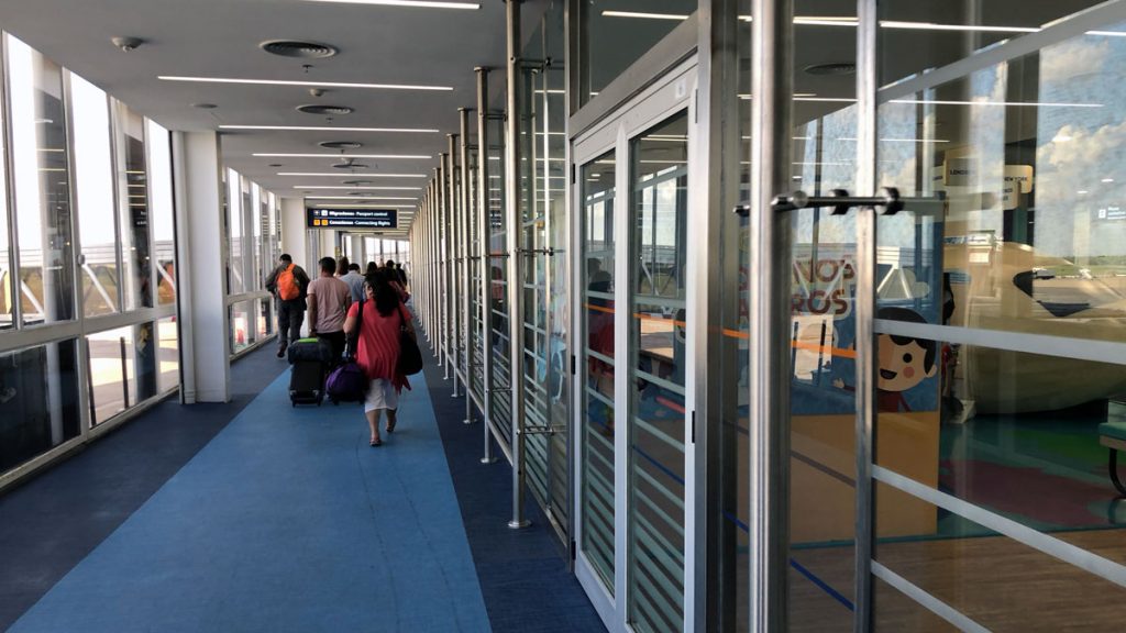 a group of people walking in a hallway