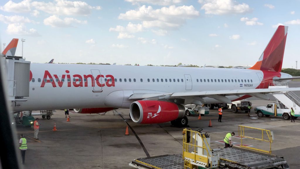 a white airplane with red writing on it