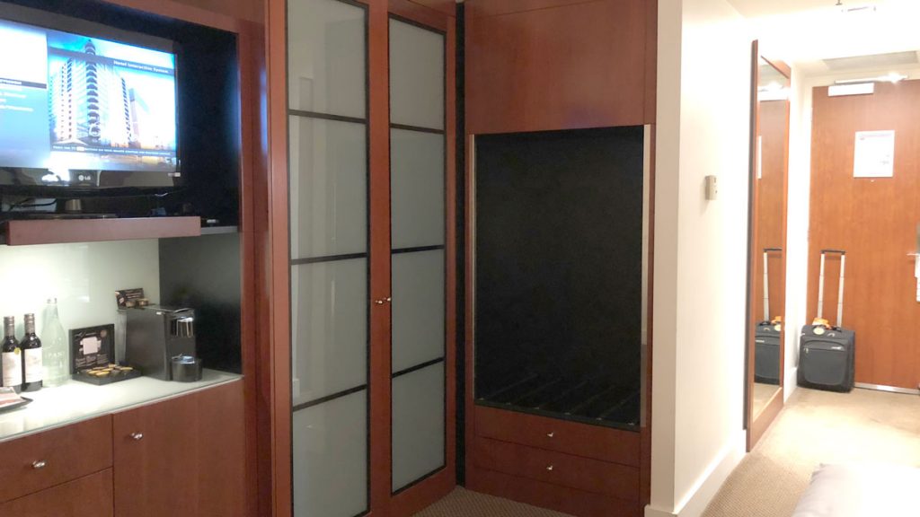 a room with a closet and shelves