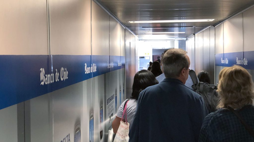 a group of people walking down a hallway