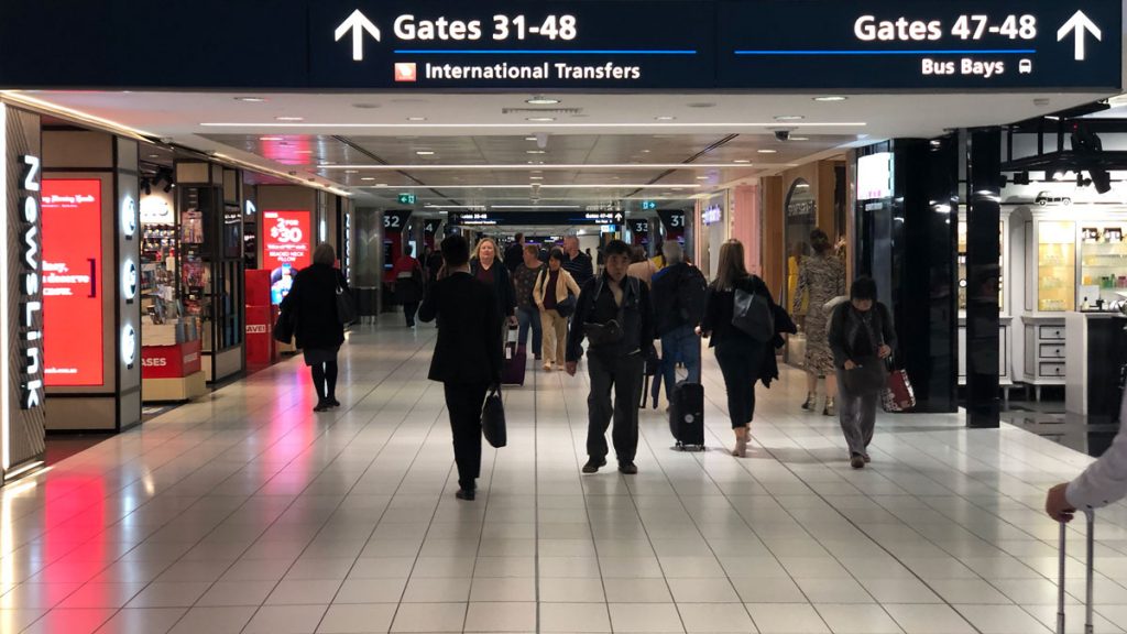 a group of people walking in a terminal
