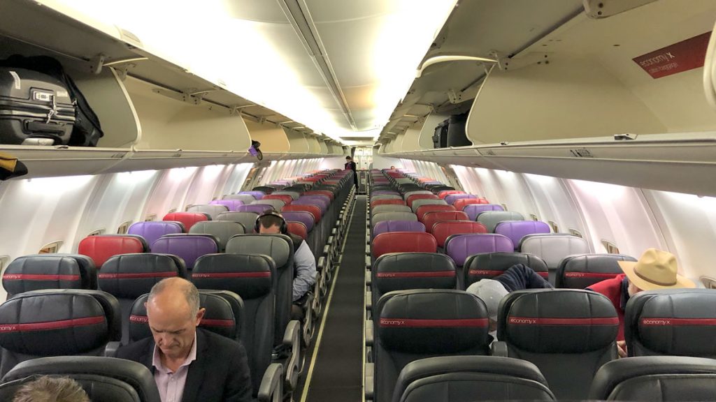 a group of people sitting in an airplane