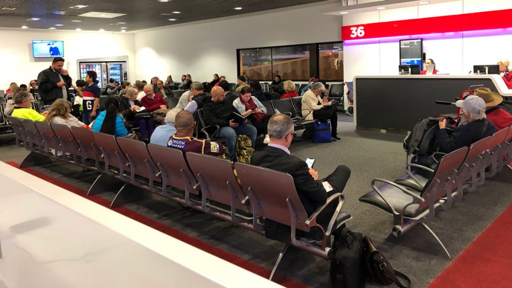 a group of people sitting in a waiting room