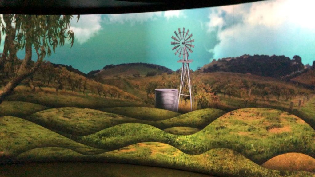 a screen with a windmill and a barrel