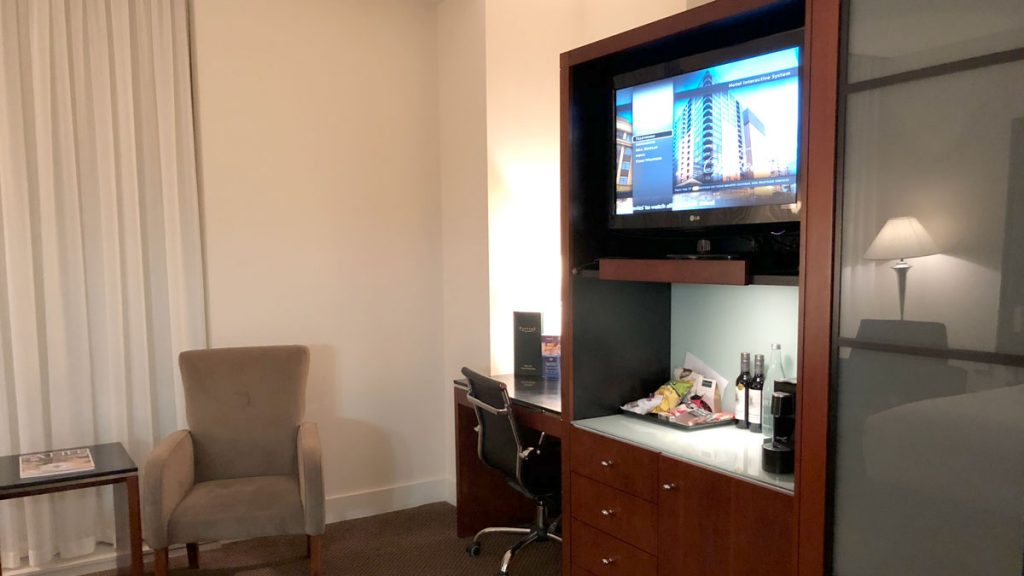 a room with a television and chair