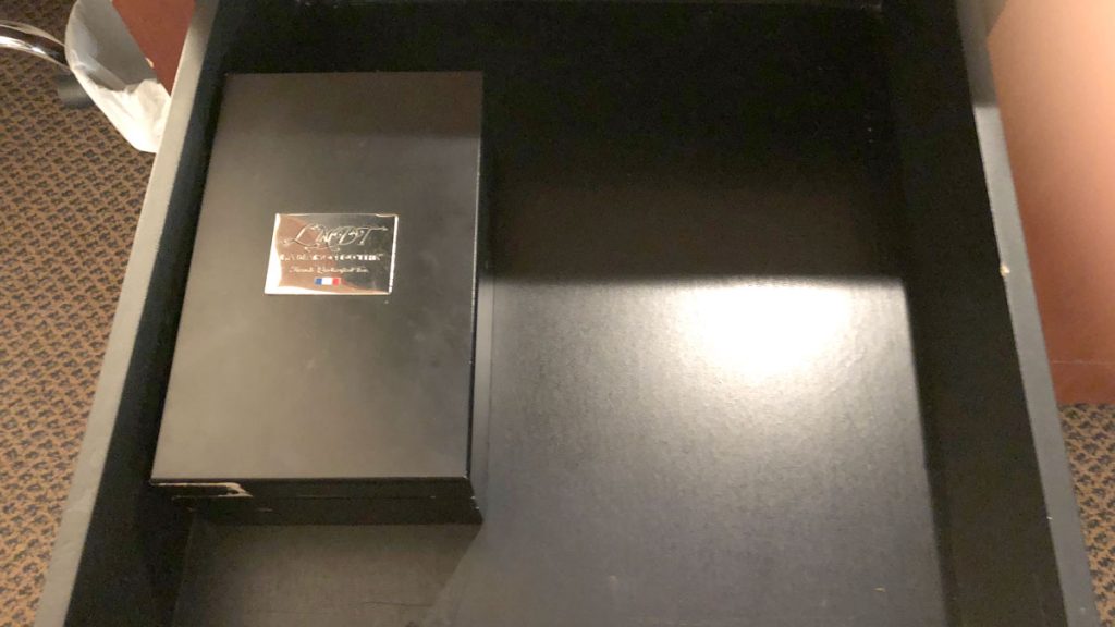 a black box with a silver label on it