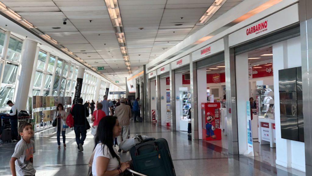 a woman with luggage in a airport