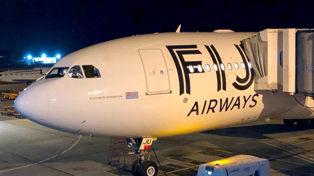 a plane on the tarmac at night