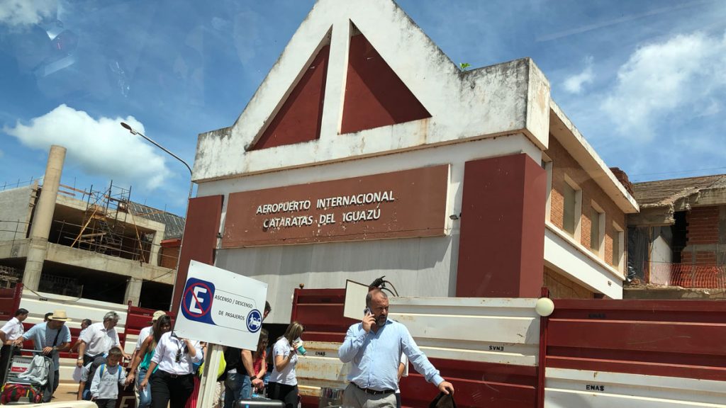 a man walking in front of a building