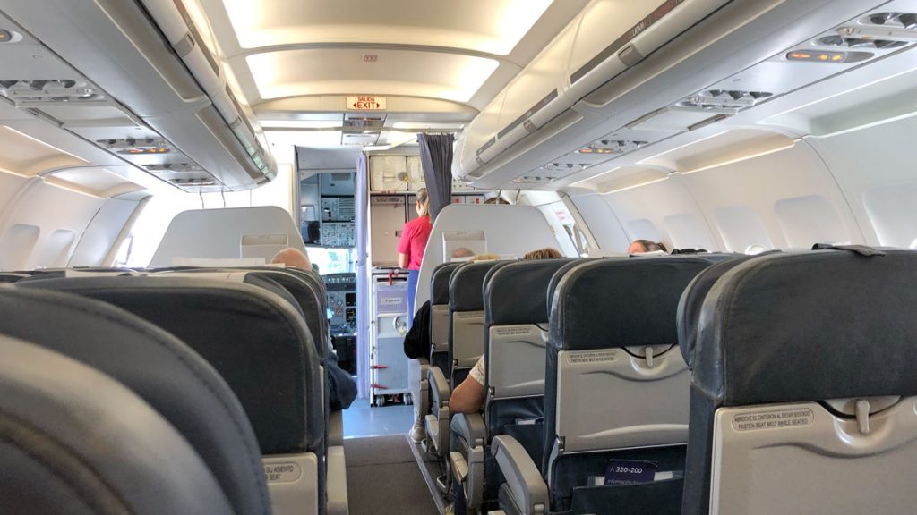 a plane with people sitting in the seats