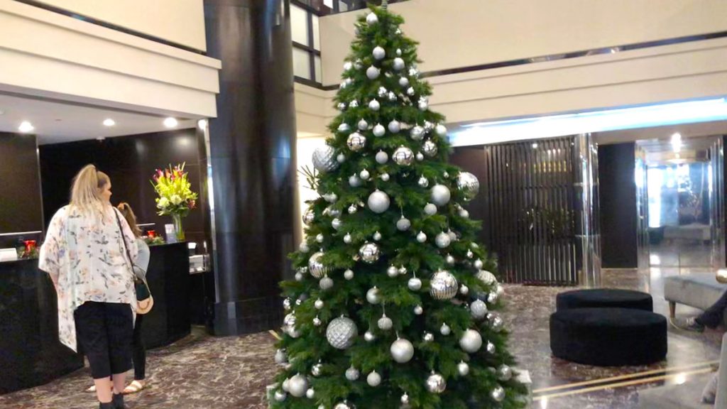 a christmas tree in a lobby