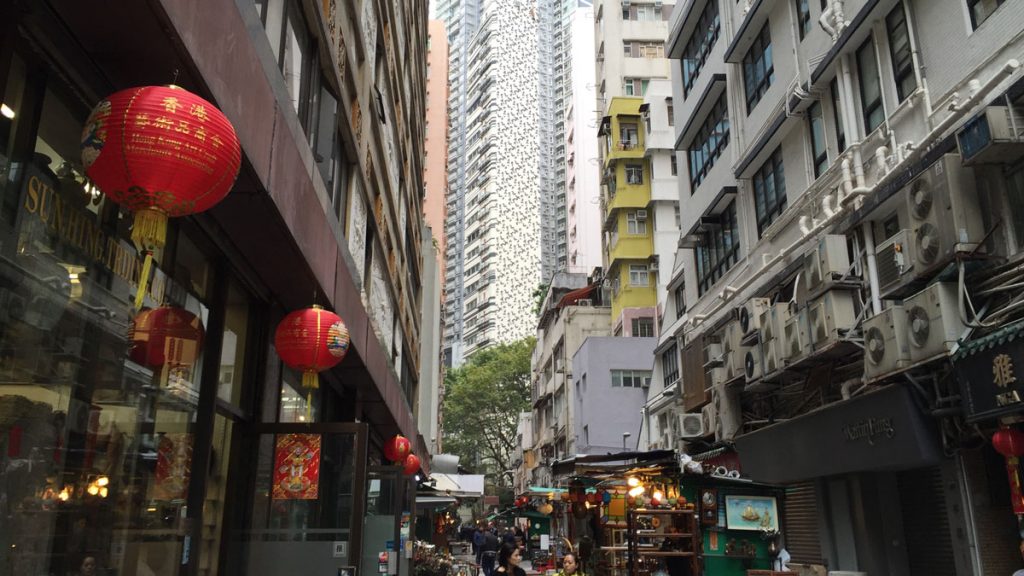 a street with buildings and people