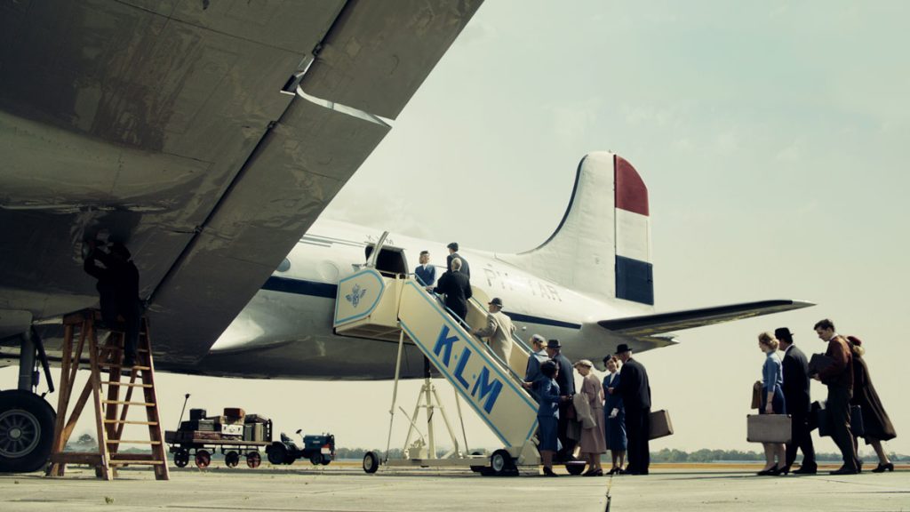 a group of people boarding an airplane