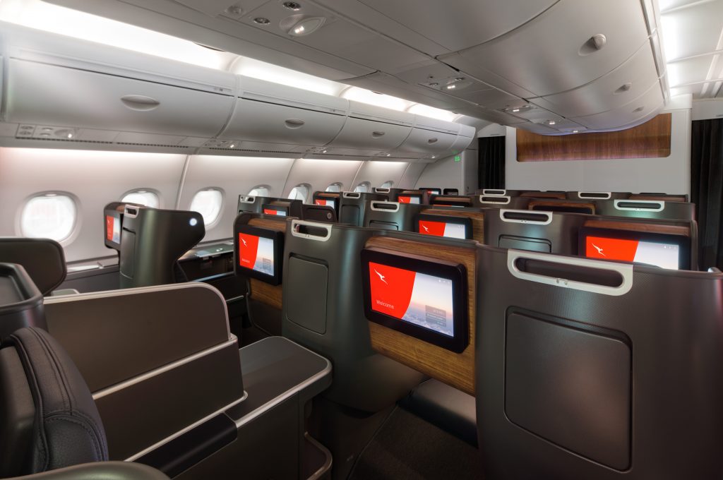 the inside of an airplane with a television screen