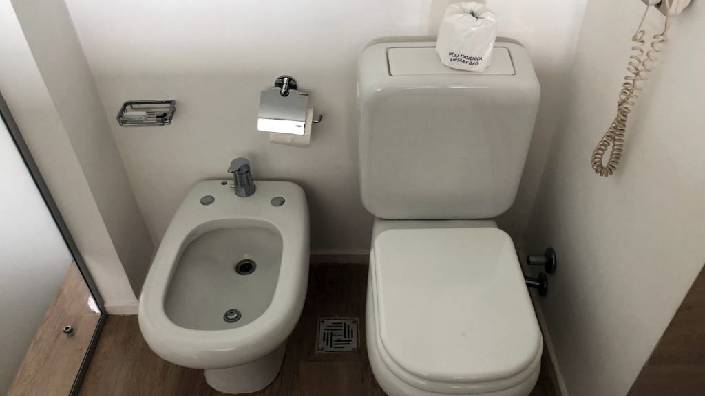 a toilet and bidet in a bathroom