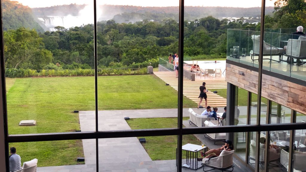 a view of a pool from a window of a building