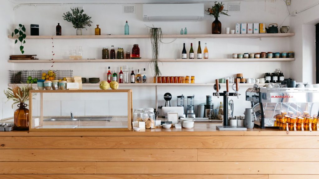 a counter with shelves and bottles on it