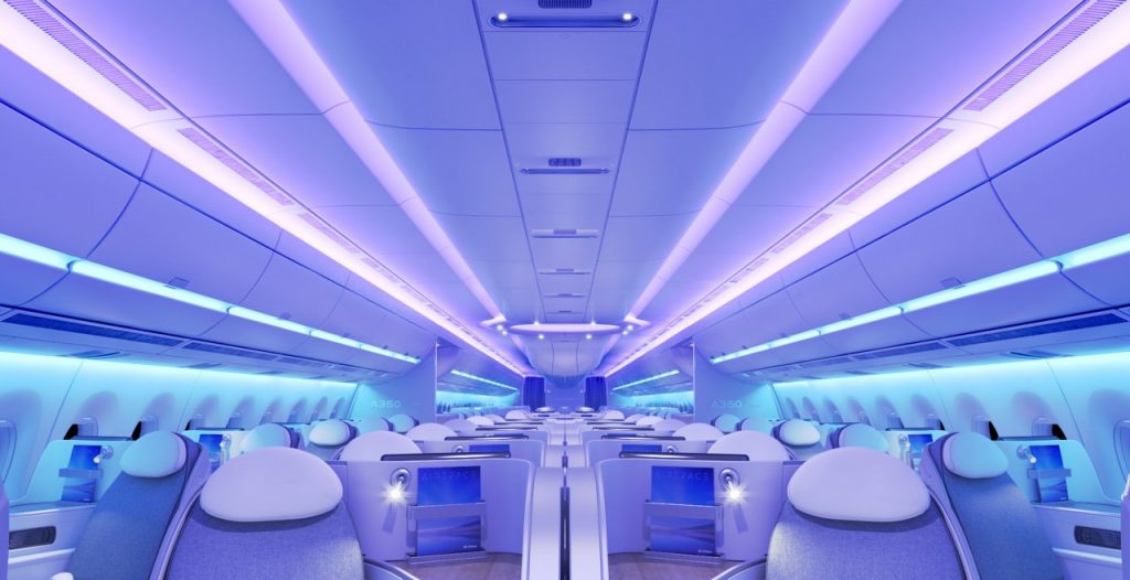 inside an airplane with rows of seats