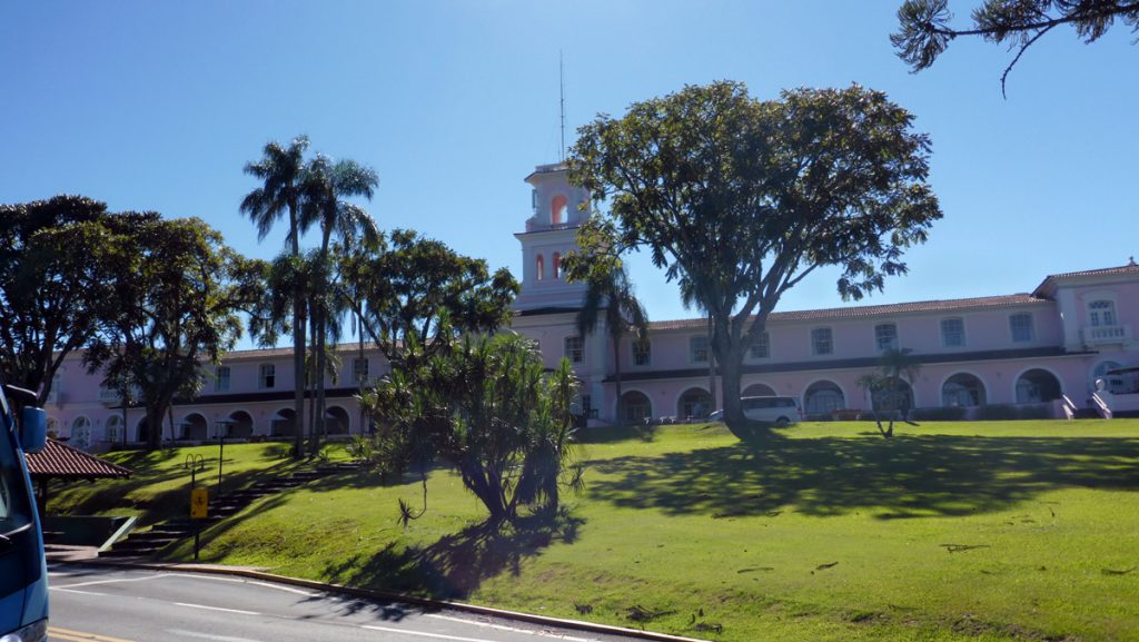 a building with trees and grass