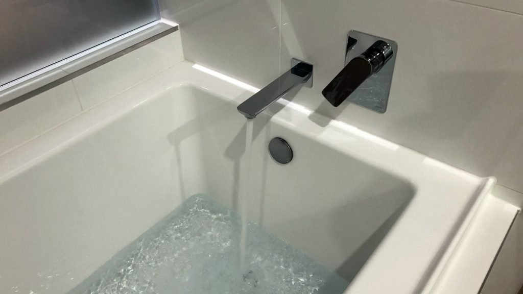 a bathtub with water running out of it
