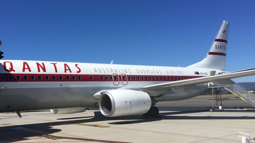 a white airplane on a runway