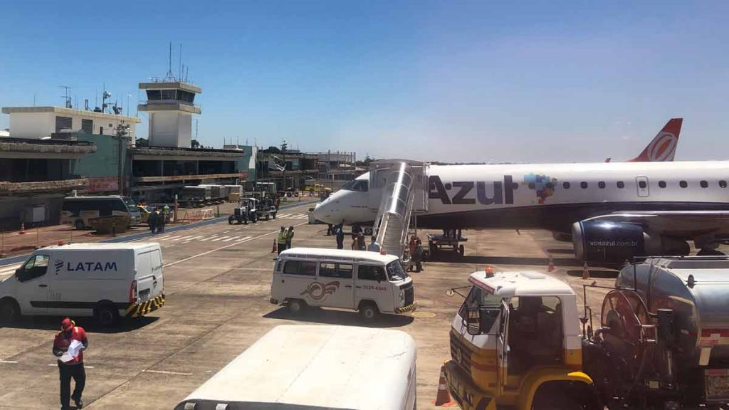 a group of vehicles parked on a runway