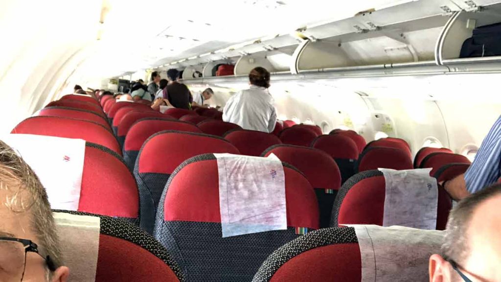 a group of people sitting in an airplane