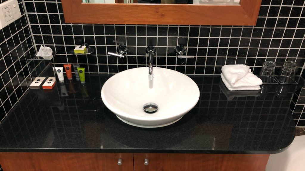 a sink with a mirror above it