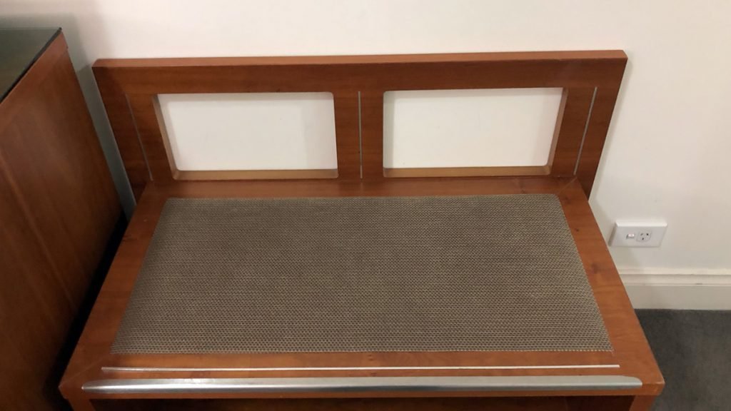 a wooden bench with a mat