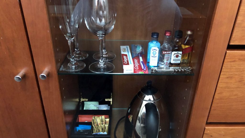 a shelf with glasses and other objects