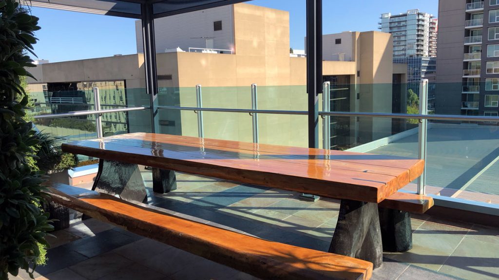 a wooden bench on a patio