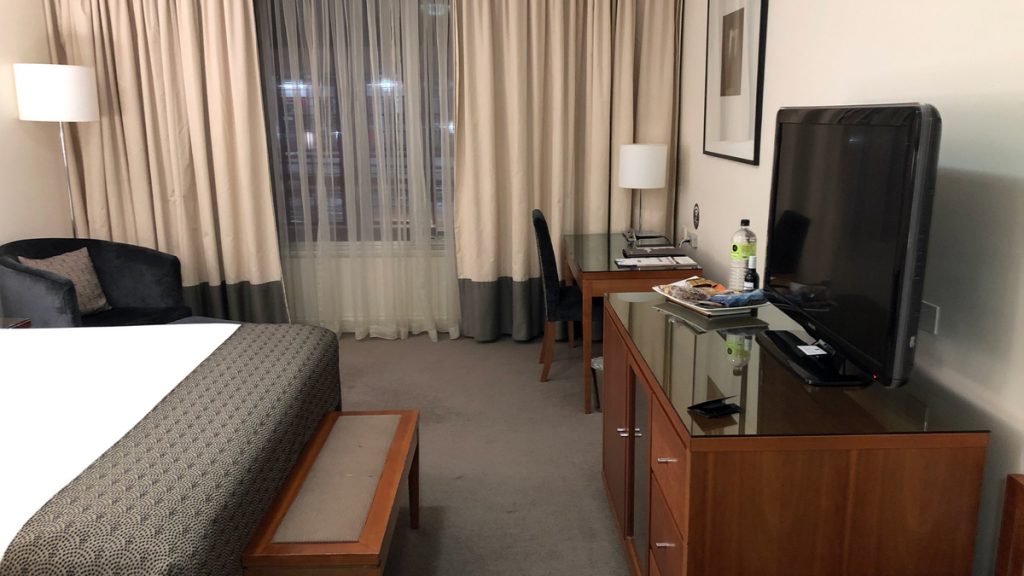 a room with a bed and a desk