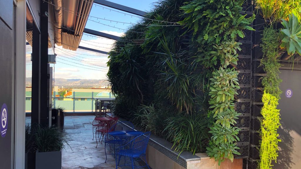 a patio with chairs and tables