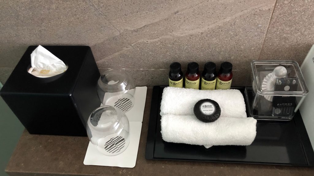 a towel and bottles on a tray